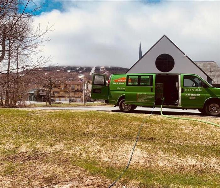 24 Hour Emergency Flood, Fire or Mold - image of SERVPRO vehicle parked outside